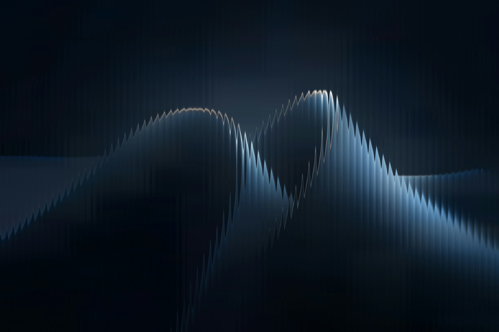 Abstract waves resemble mountain ridges in blue.